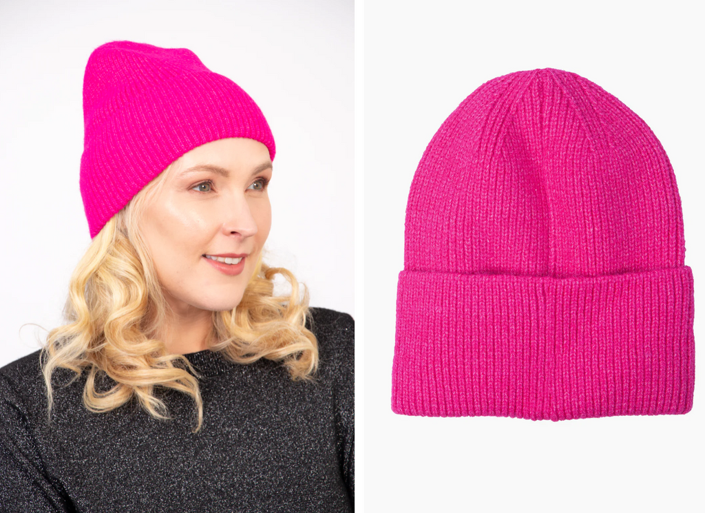 model wearing hot pink plain beanie hat in soft acrylic 